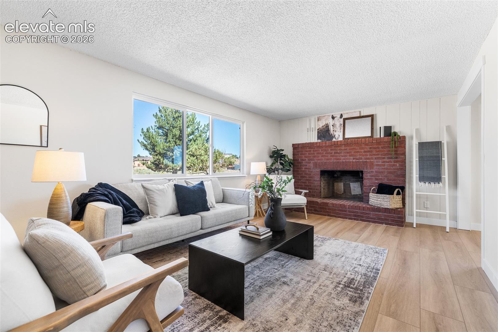 New luxury vinyl plank flooring, new paint, vinyl windows and lots of natural sun light with a wood burning fireplace that has been inspected and cleaned.