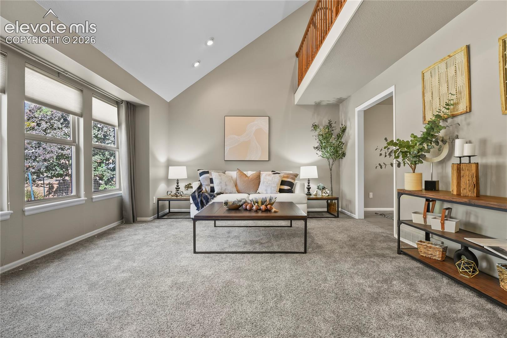 Vaulted ceilings, multi-pane windows, neutral carpeting