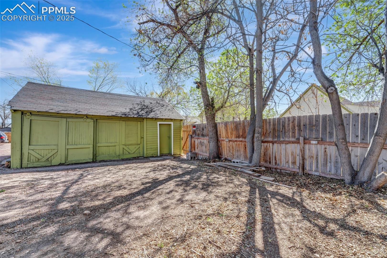 Alley entrance to garage with additional parking
