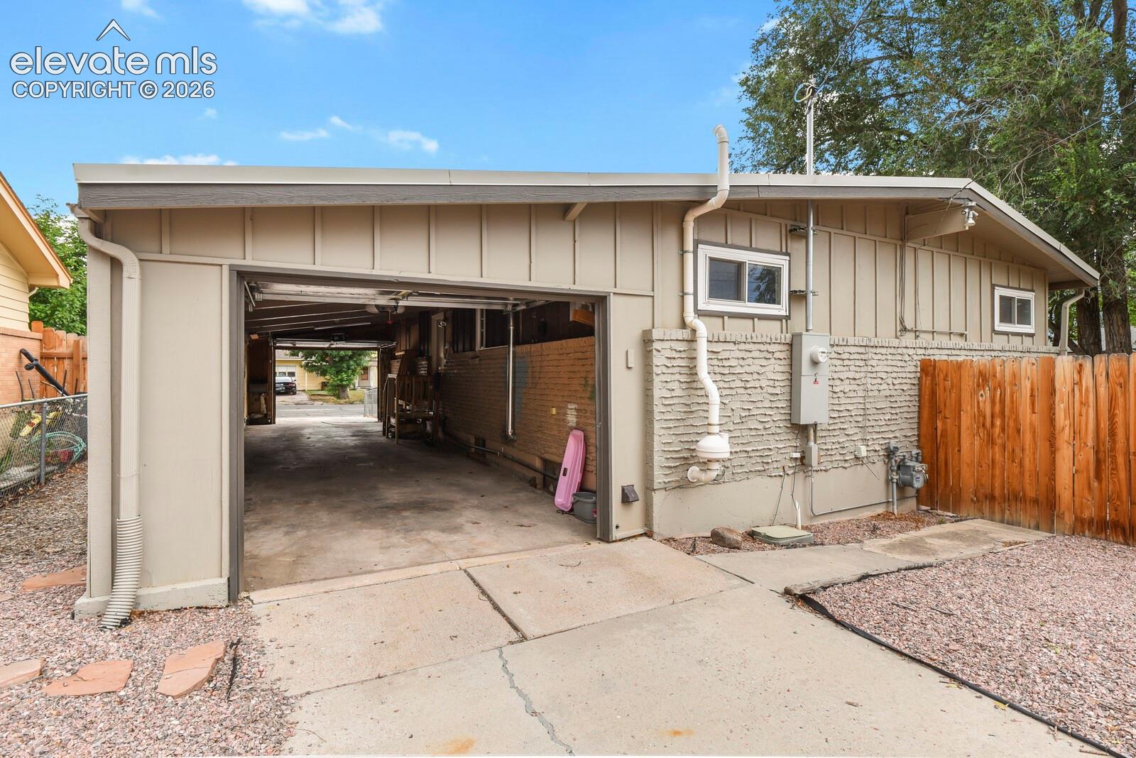 Shot of the 12' x 42', 2-car-tandem, drive-through garage from the back southeast corner of the property.