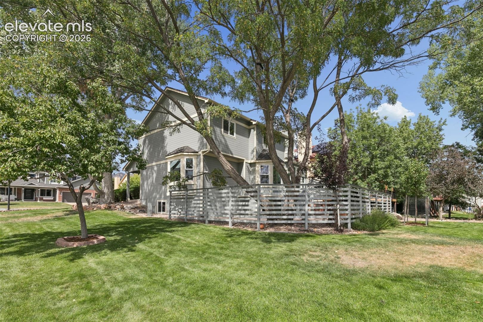 Enjoy the best of both worlds: a secluded patio behind privacy fencing, plus generous yard space beyond for games and activities.