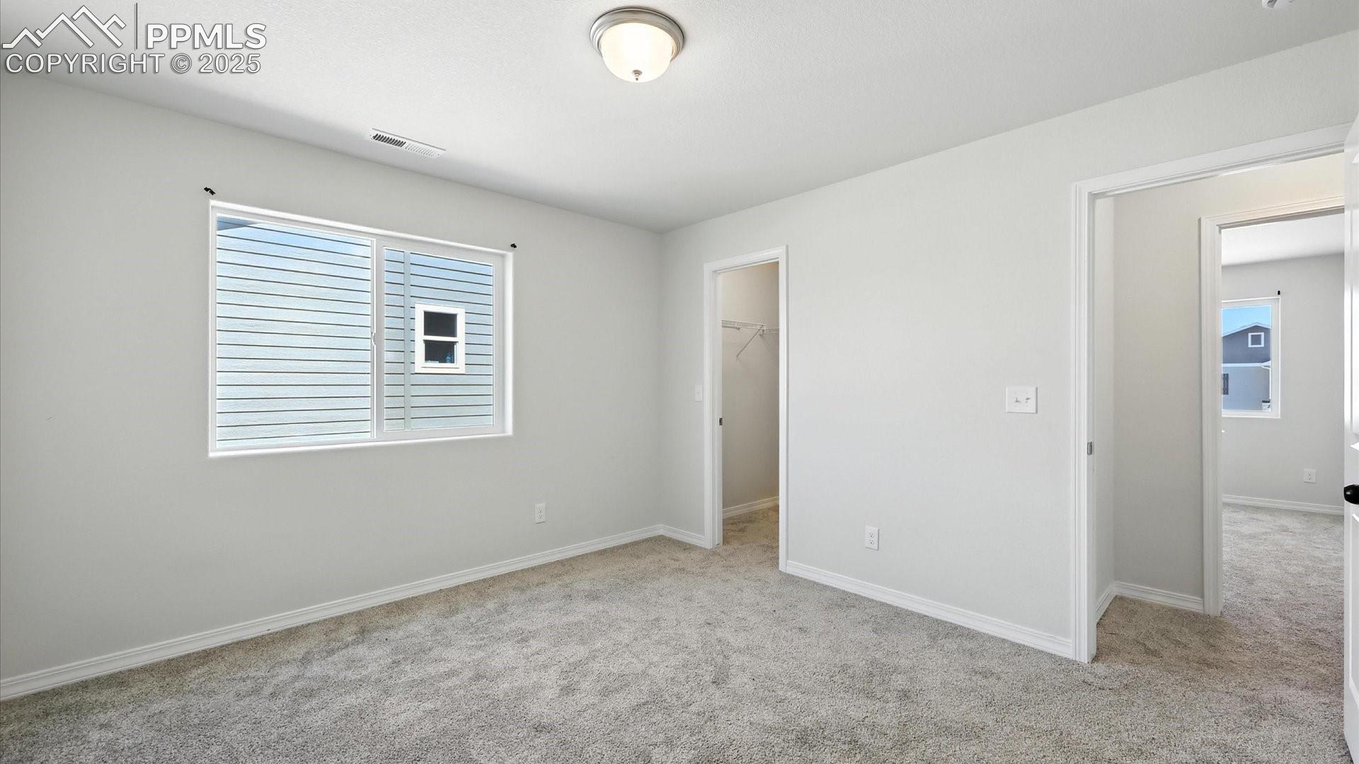 Upper Level Bedroom #3 has a walk in closet.