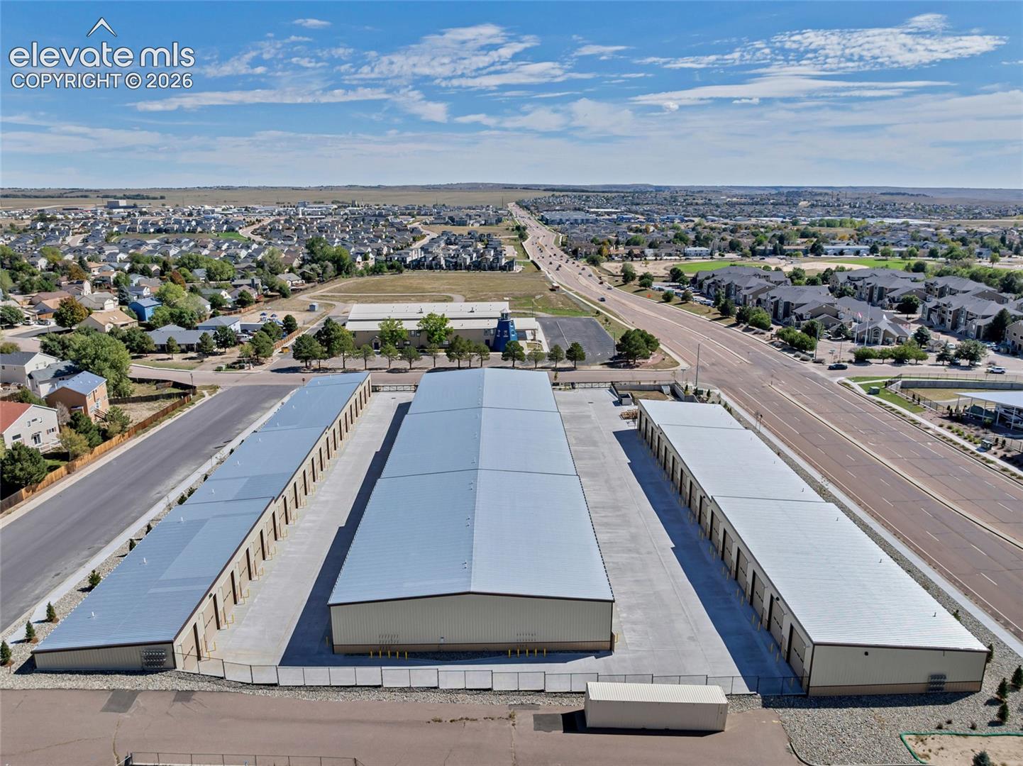 Multiple storage buildings with metal roofs