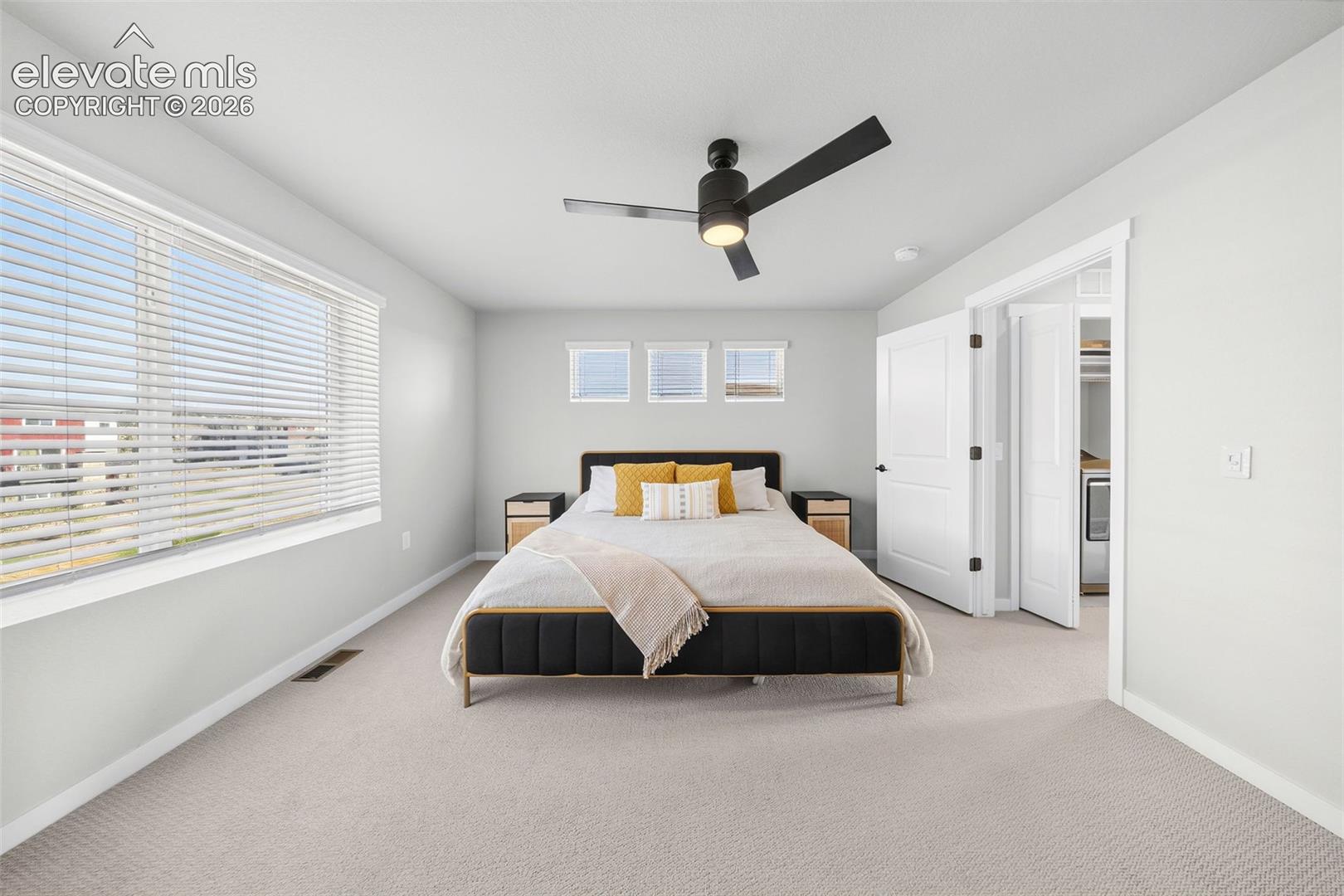 The primary bedroom is at the back of the upper level. It has space for a king-sized bed and all your furnishings plus incredible views out of the double windows. 