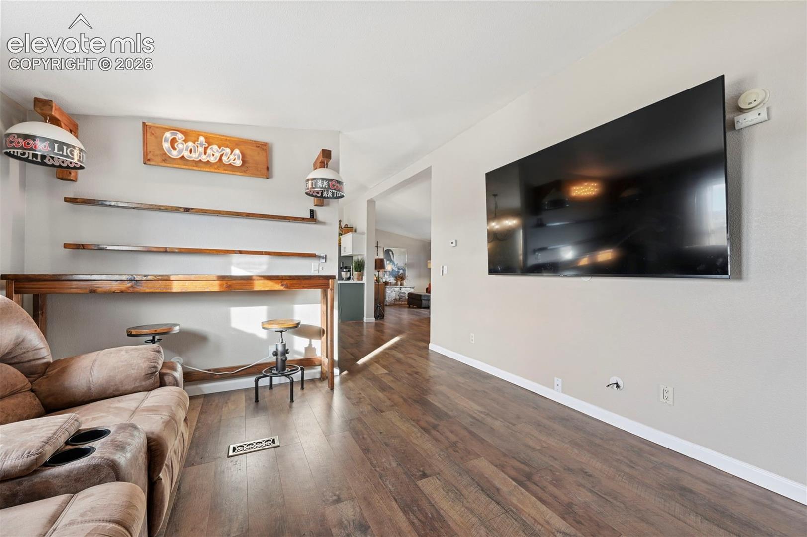 Wood-finish flooring and built-in floating wall shelving