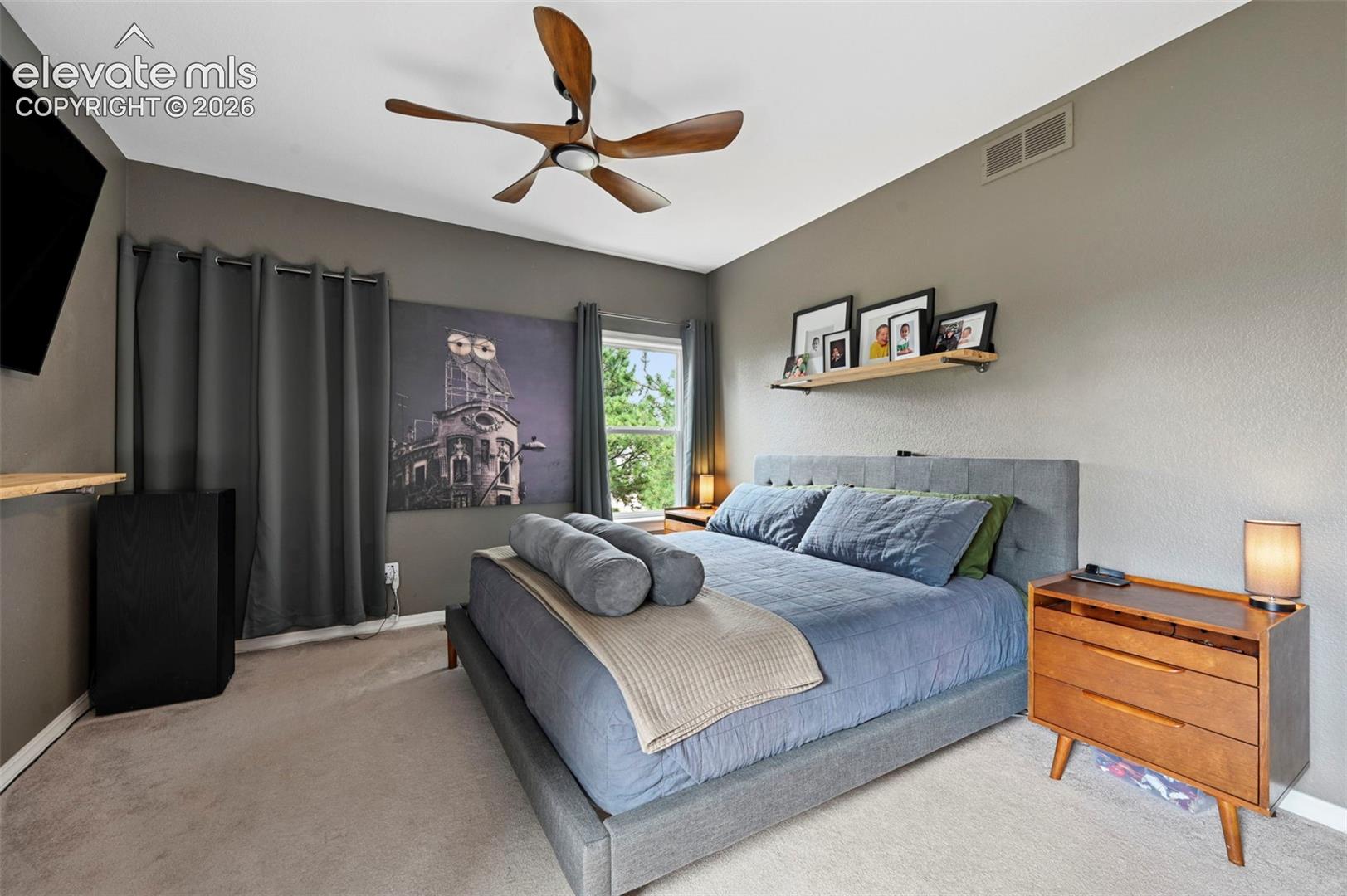 Recessed lighting, ceiling fan with integrated lighting, window, and wall-mounted shelving
