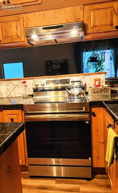 Stainless steel range with a flat cooktop