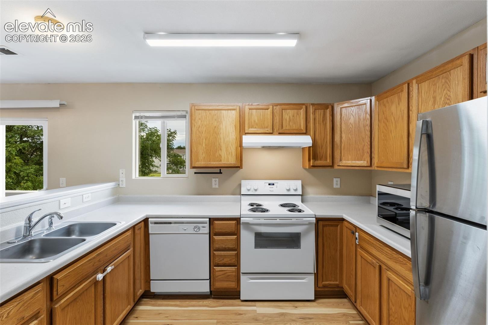 The Kitchen has an abundance of cabinets and comes equipped with a Refrigerator, Range, Range vent fan, and Dishwasher!