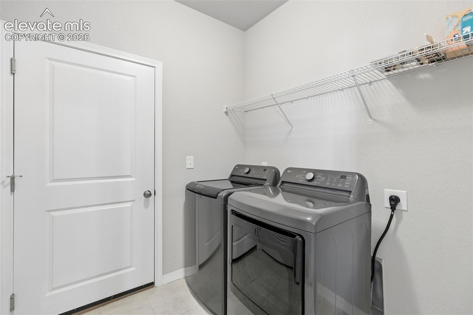 Washer and dryer included; space for cabinets or shelving.