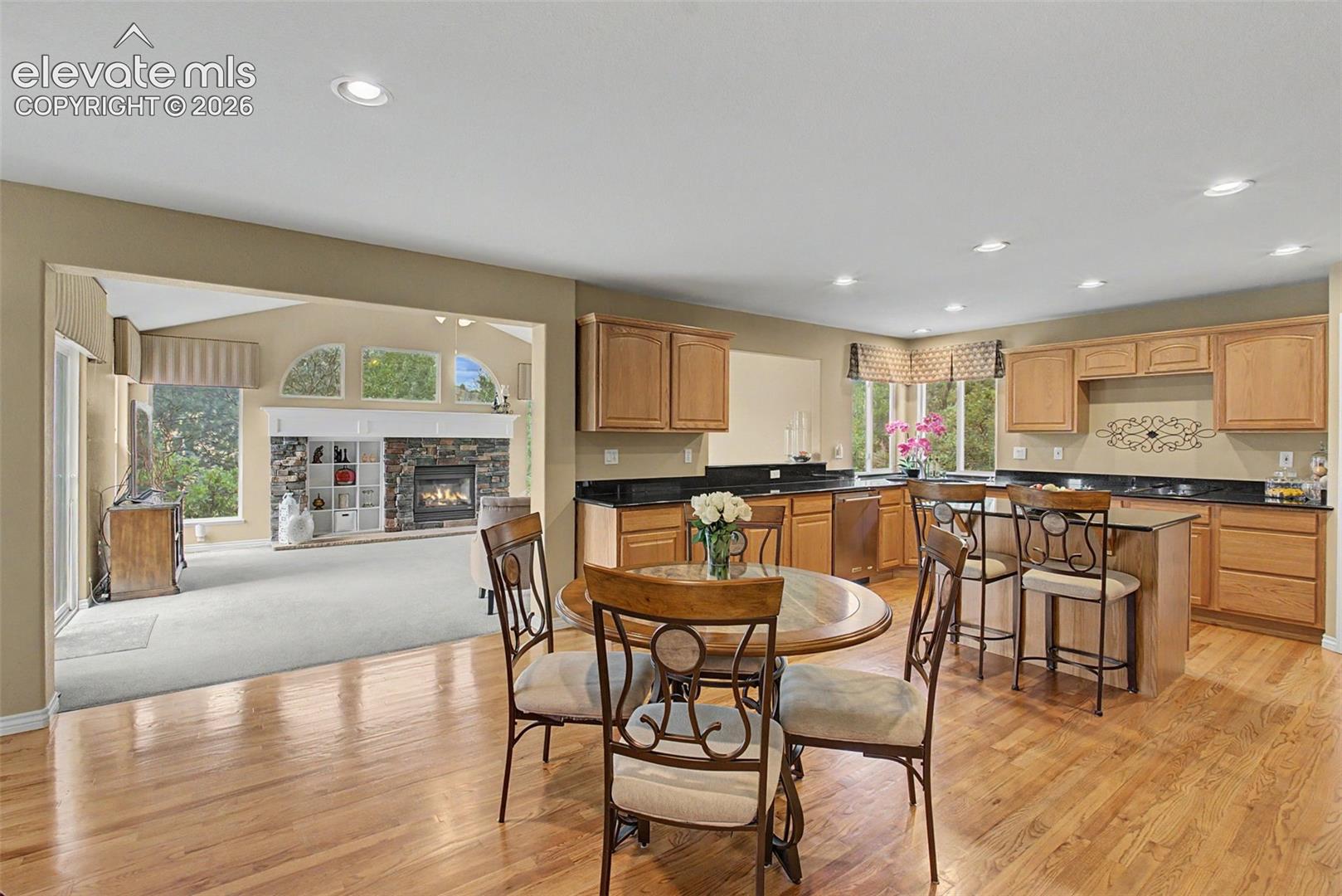 The Breakfast Nook Flows Seamlessly into the Handsome Family Room!