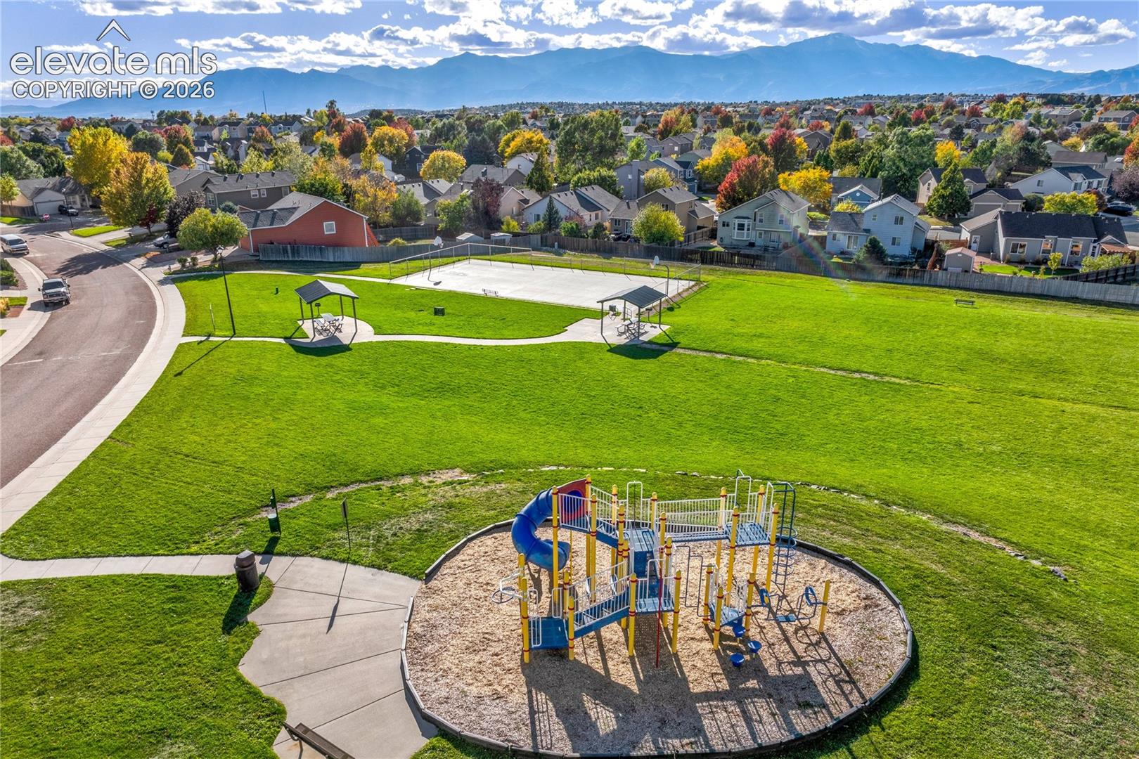 Enjoy sweeping views of the Front Range + Pikes Peak from nearby neighborhood open space, with walking paths and playground amenities adding to the appeal.