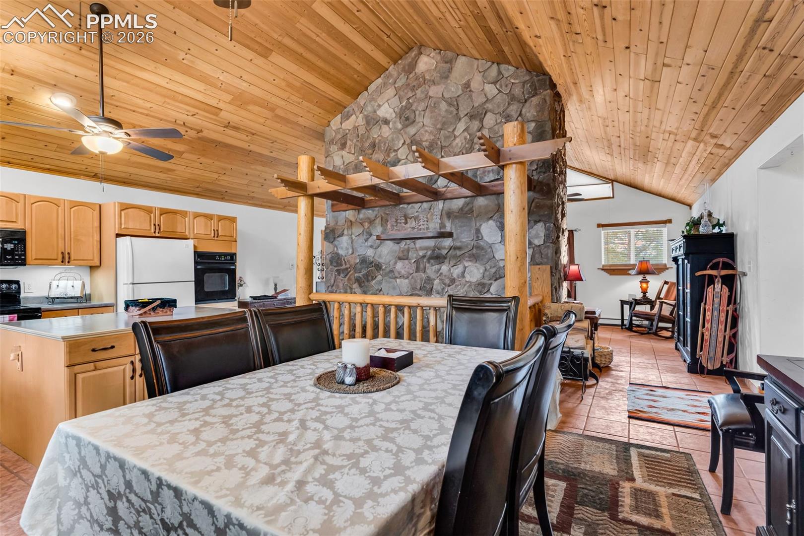Tons of character with a stone fireplace as the centerpiece of the main level