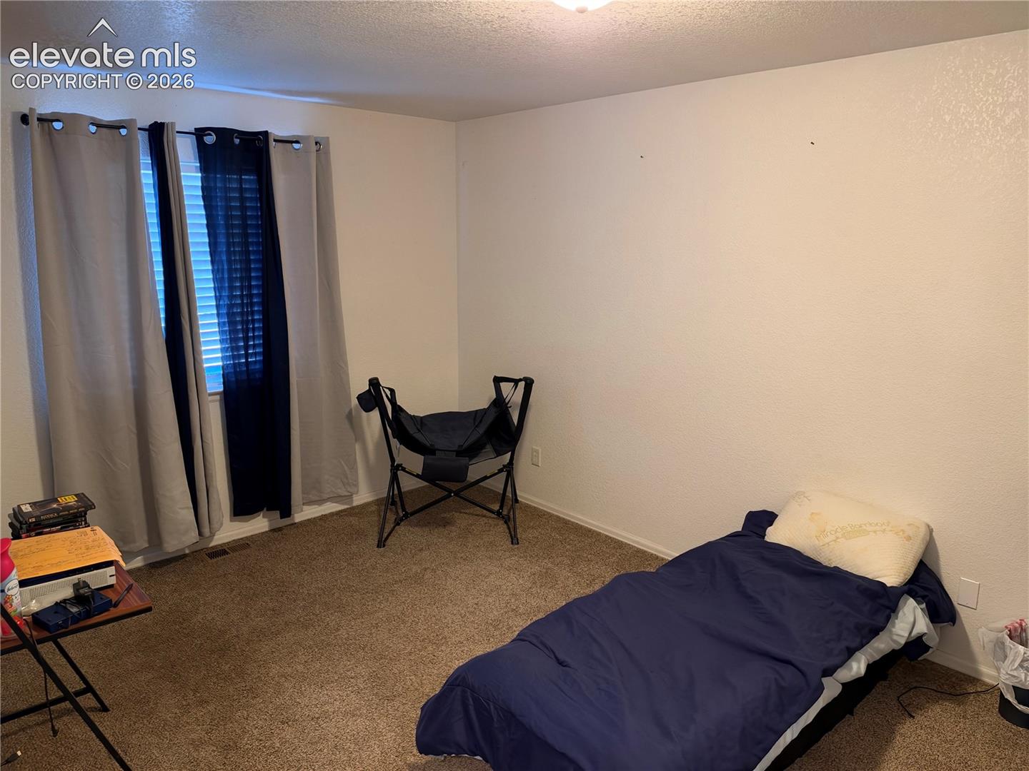 Room featuring neutral wall finishes and wall-to-wall carpeting