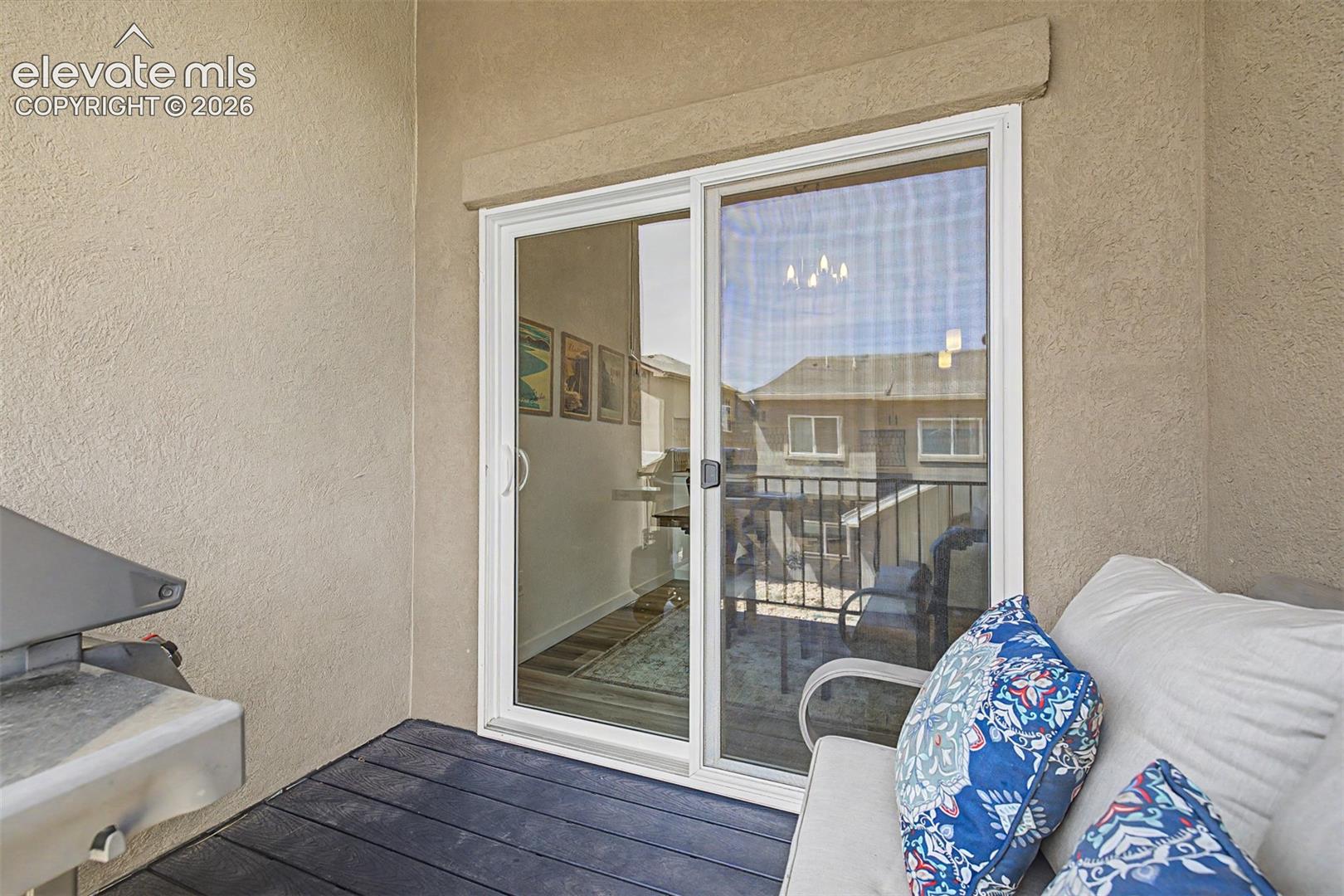 The sliding glass door from the dining area opens onto the back deck, blurring the line between inside and out and creating an effortless indoor-outdoor flow that defines Colorado living at its finest.