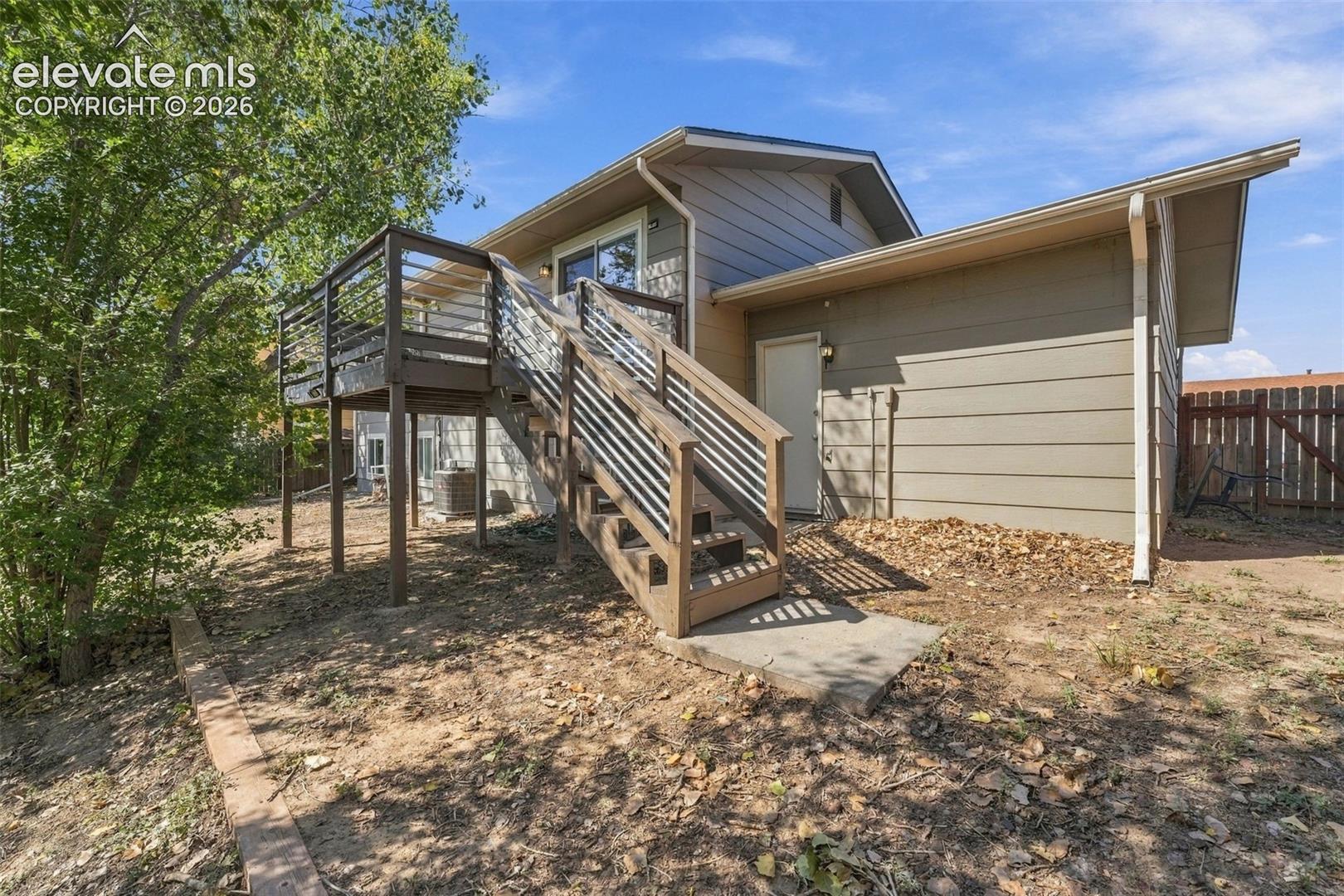 Wood-finish elevated deck with horizontal railing