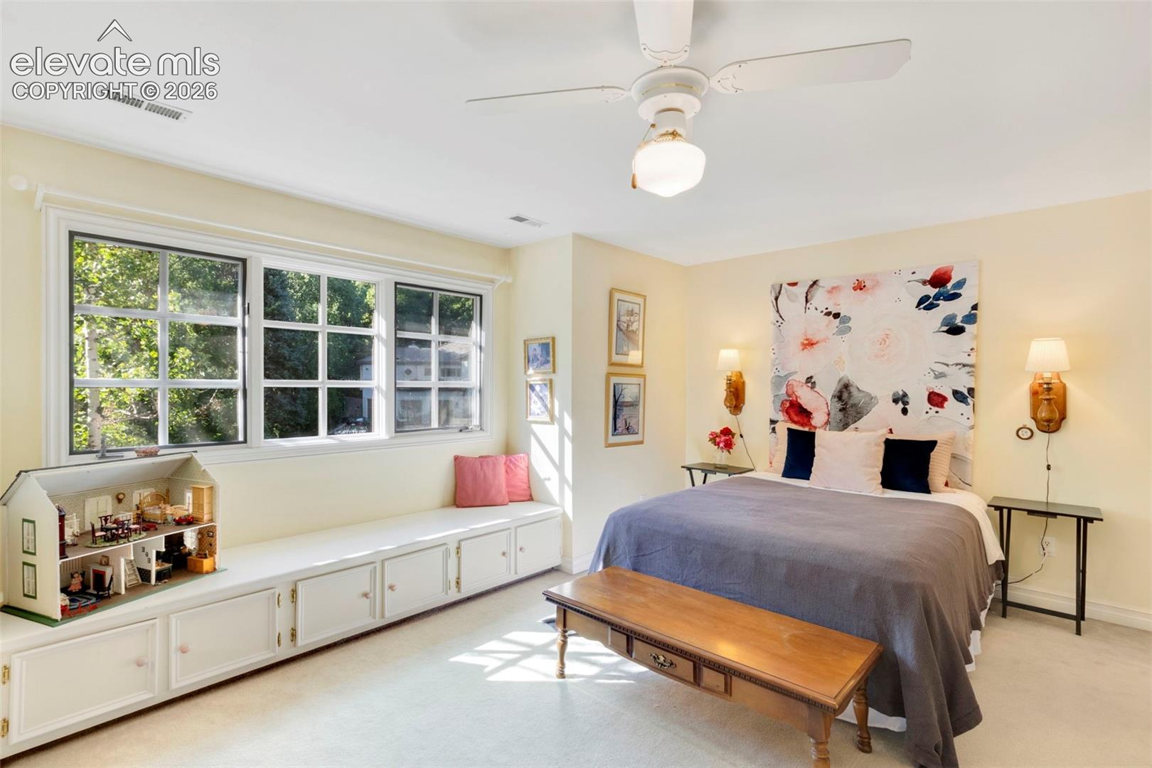 Upstairs bedroom with built-in reading bench