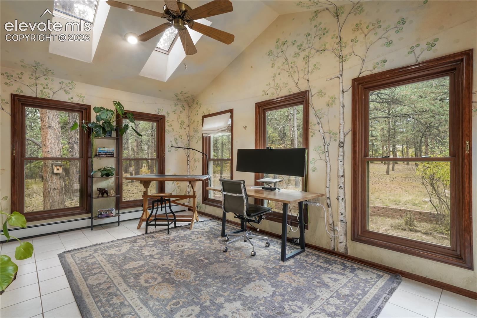 Main level office with tons of windows and natural lighting