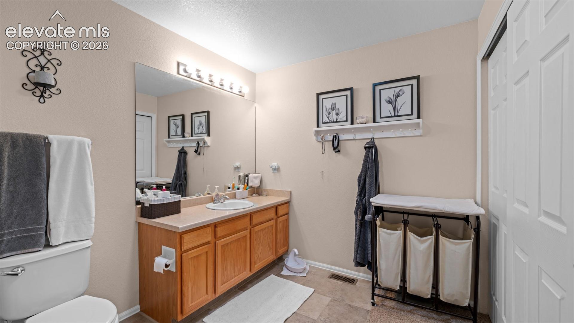 Primary Bath with Good Counter Space, Double Closets, Tile Floor and Double Closets
