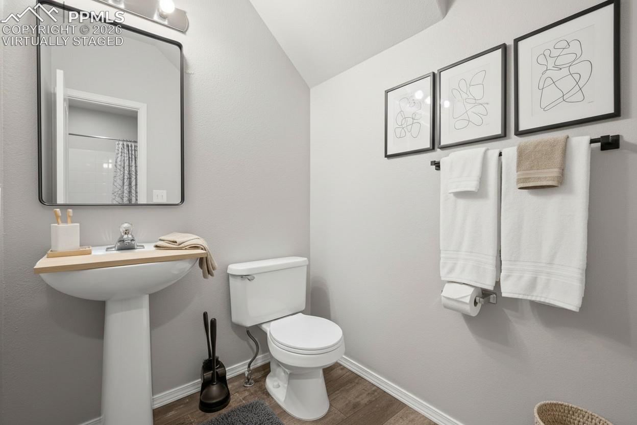 Half bath on main floor. This photo is virtually staged.