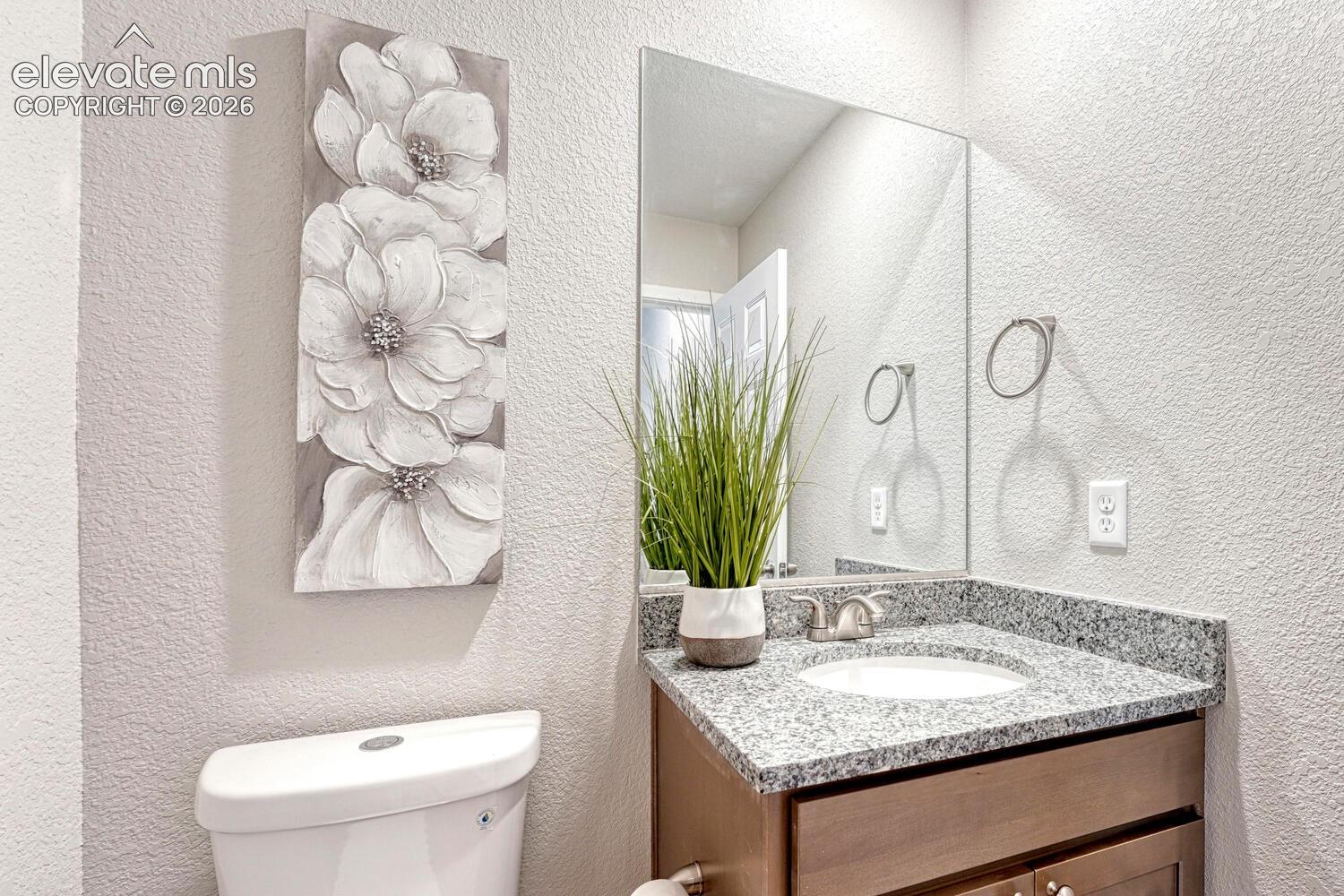 Half bath with your choice of cabinetry and countertop is on the main level. Undermount sink is standard.