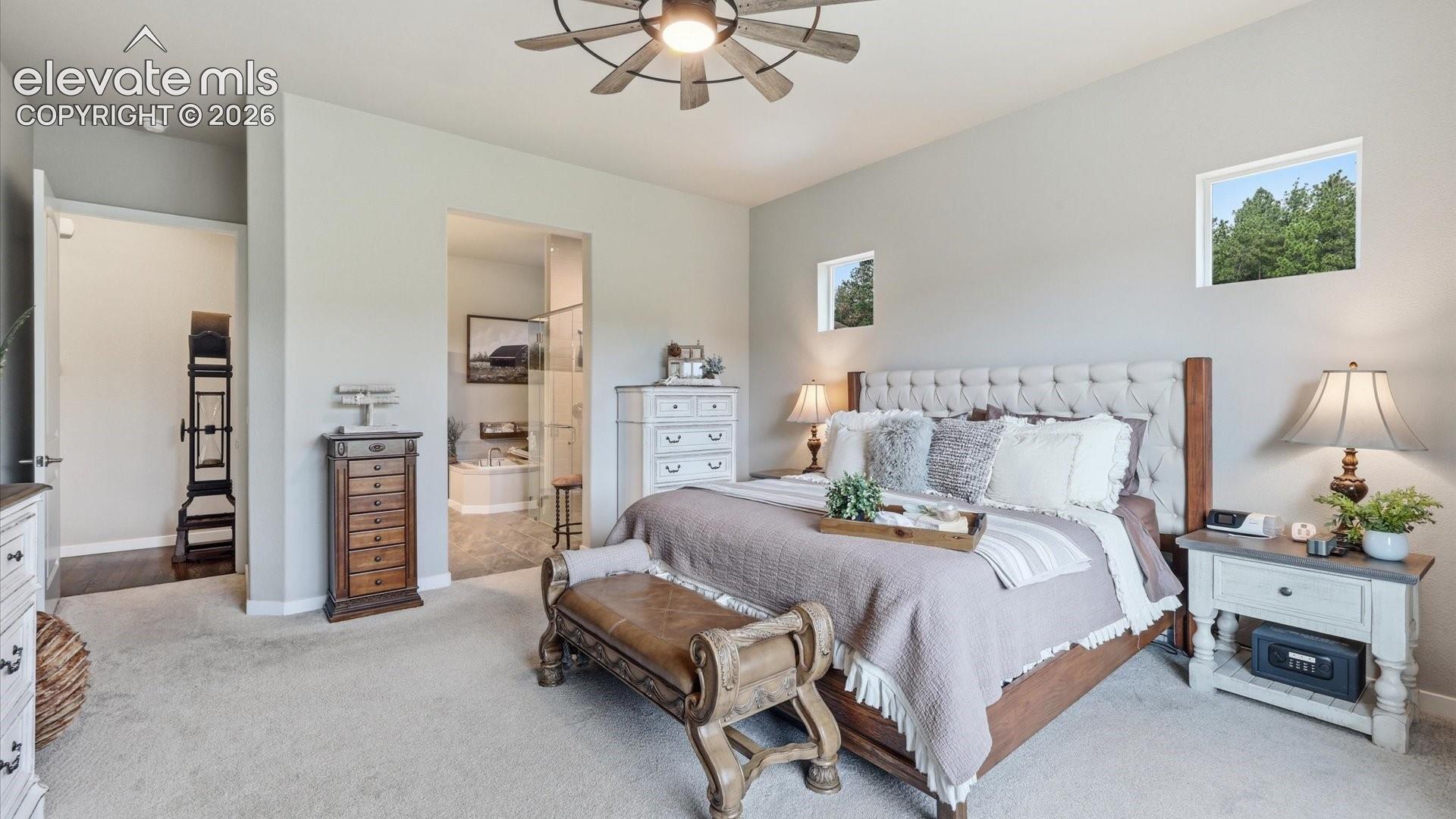PRIMARY SUITE PERFECTION — Generous proportions and a private en-suite bath combine to create a sophisticated retreat at the end of the day.