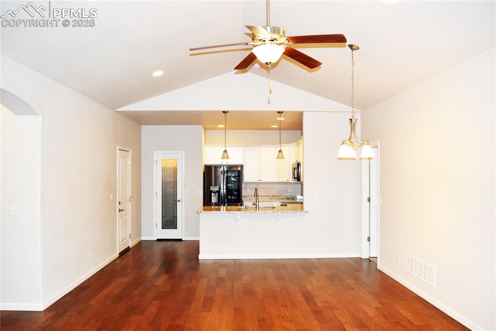 Living/dining area with kitchen beyond