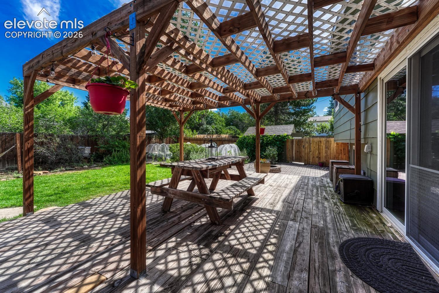 Expansive deck with pergola.