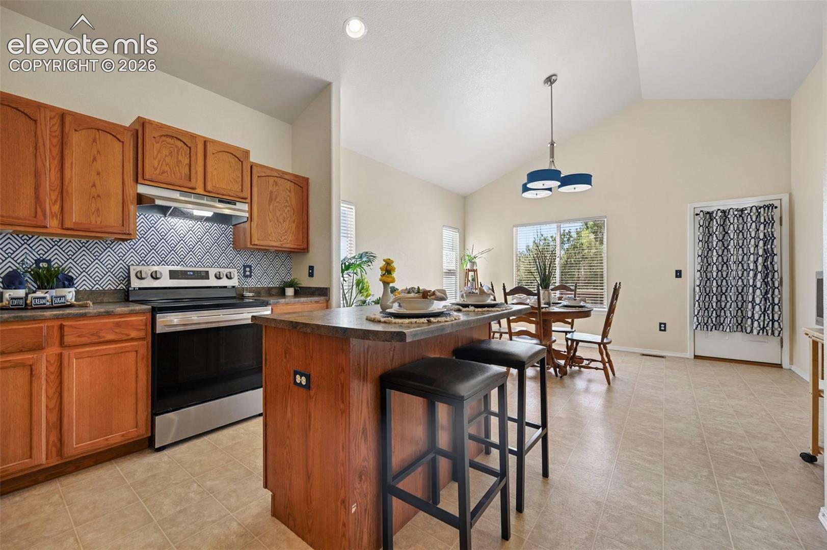 Large open kitchen with island for additional counter and seating space