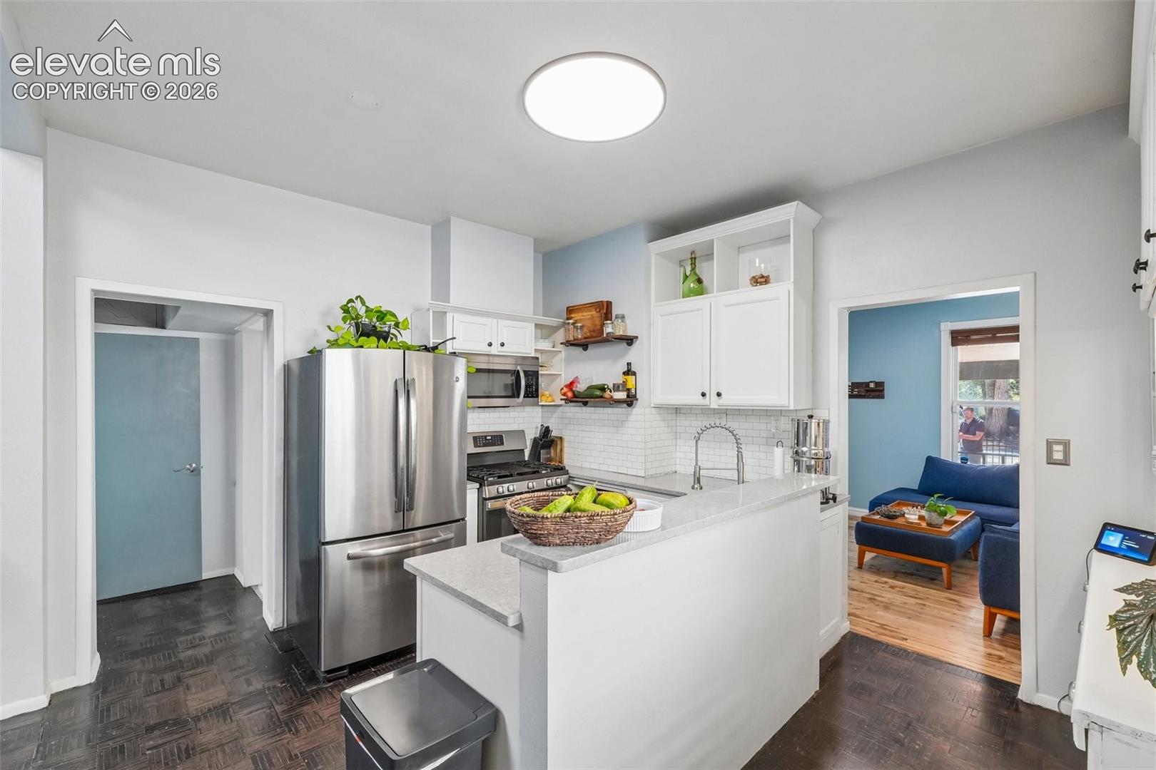 Kitchen with stainless appliances and a gas range