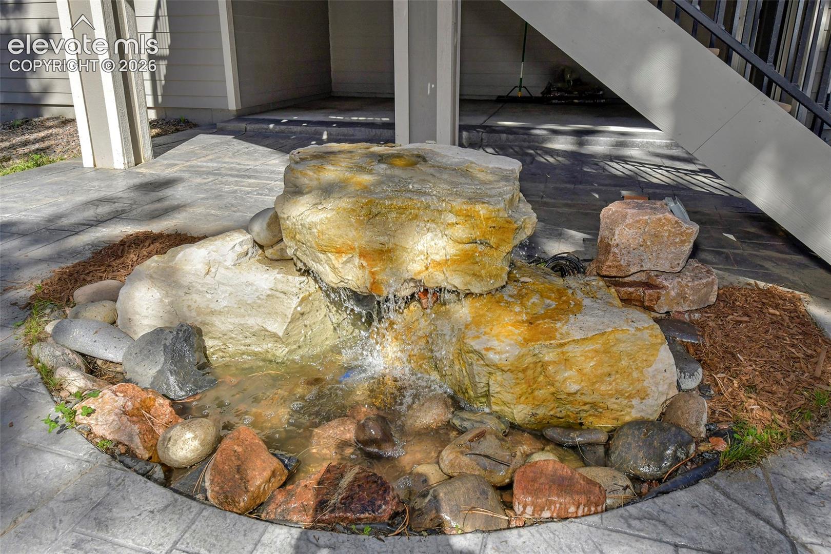 Water feature on Stamped concrete patio