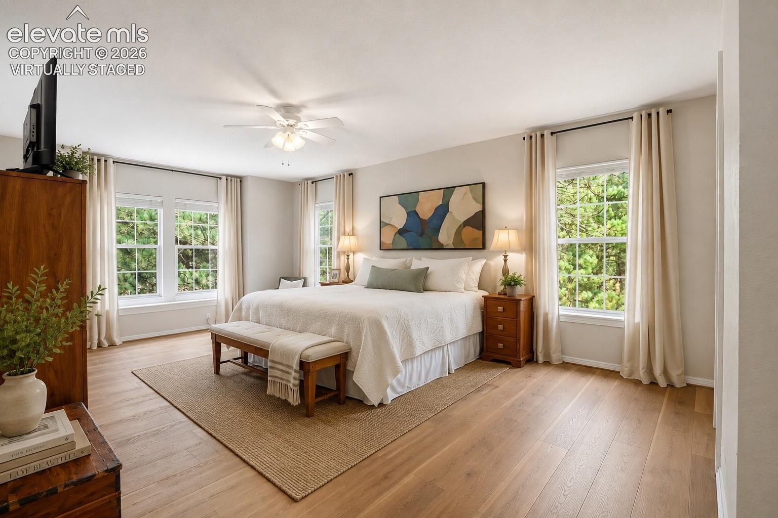 Virtually Staged spacious primary bedroom with ensuite and walk-in closet.
