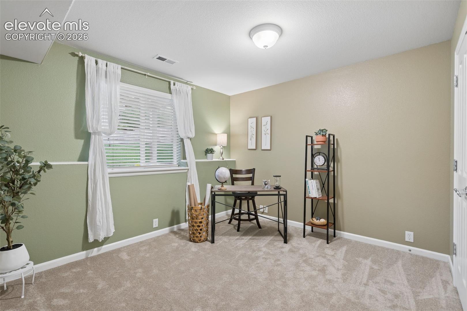 Lower level bedroom - ideal for an office or guest room