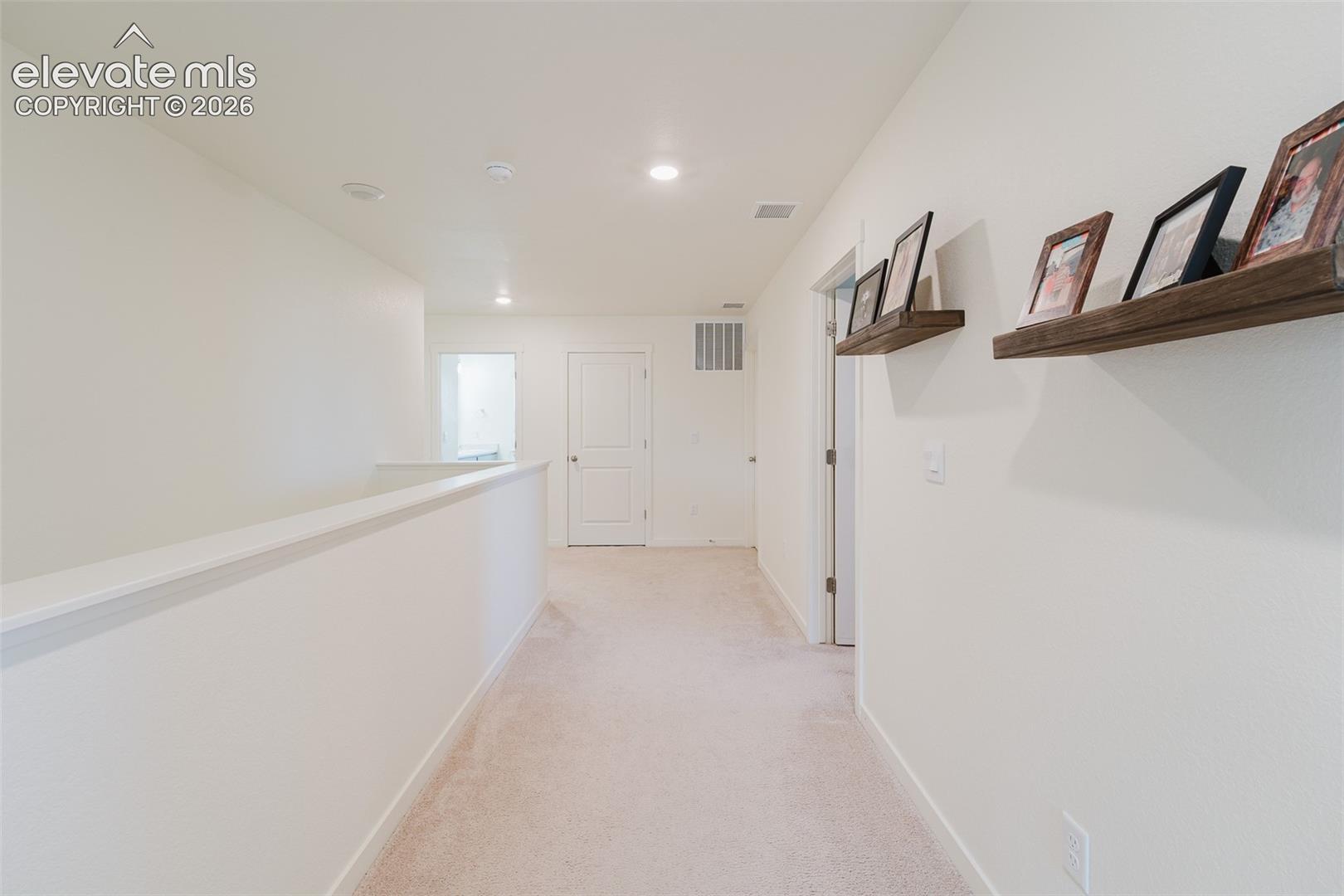 Upper level hallway to the Primary Bedroom.
