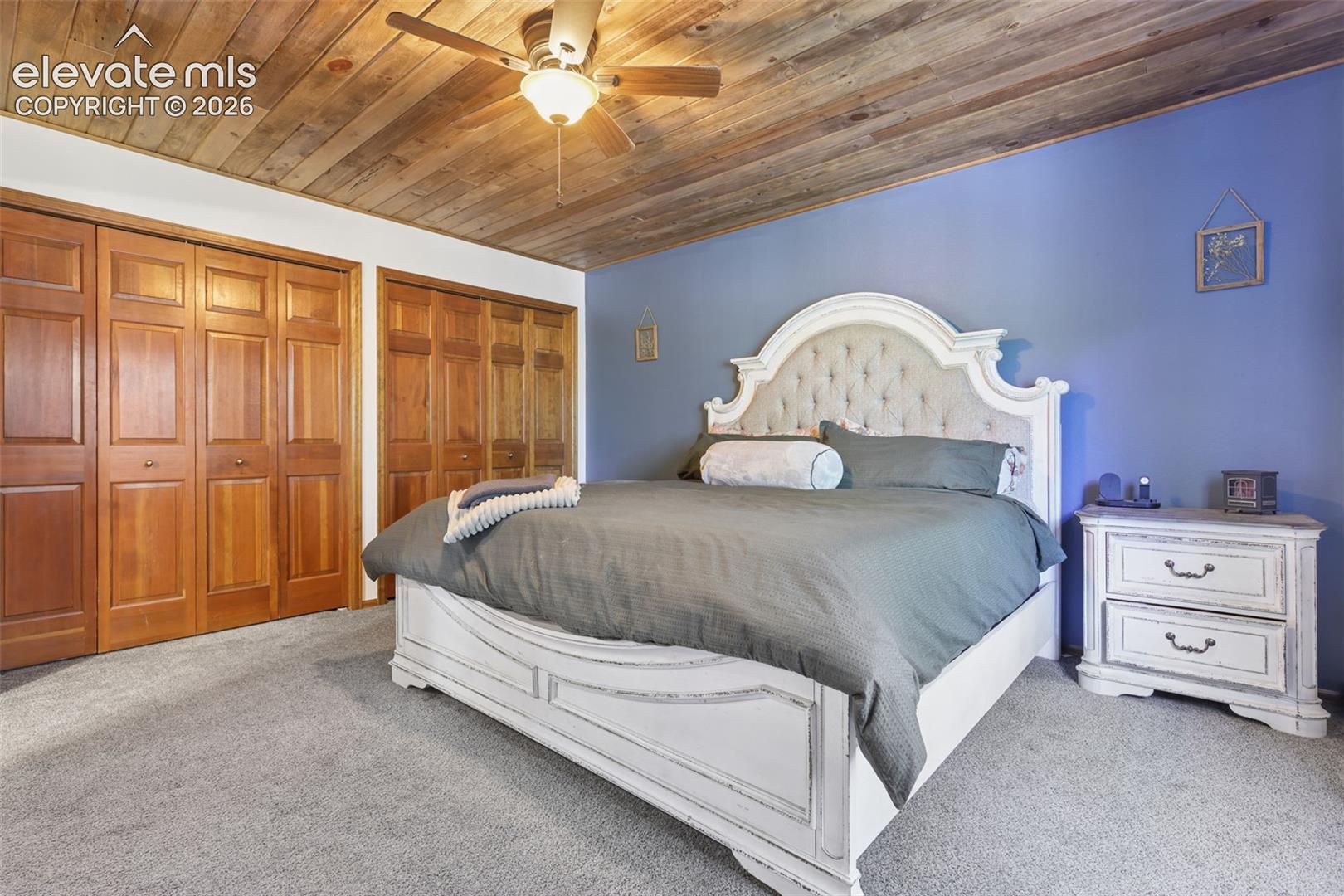 Wood-finish plank ceiling with a ceiling fan