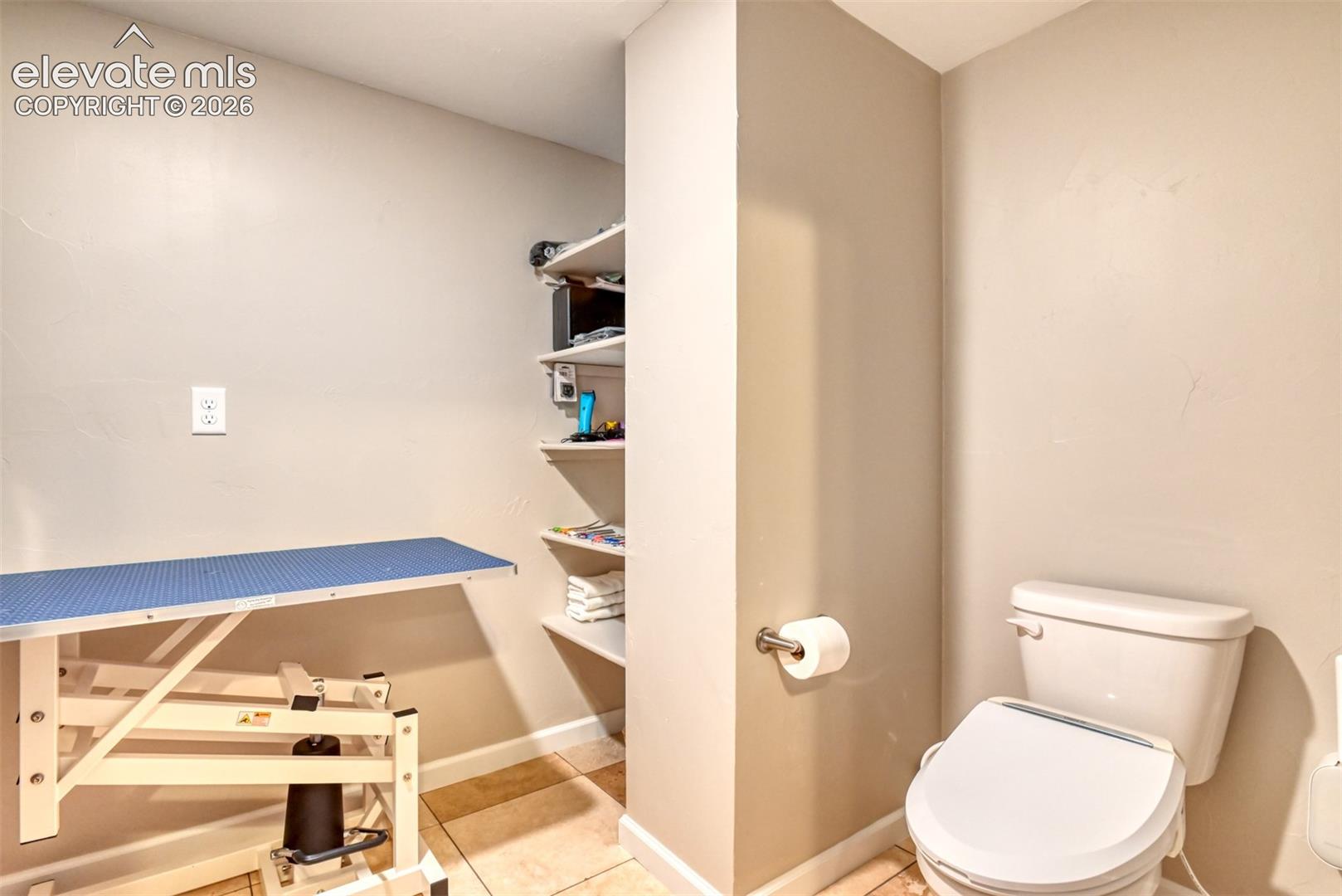 Half bathroom with dog wash station.