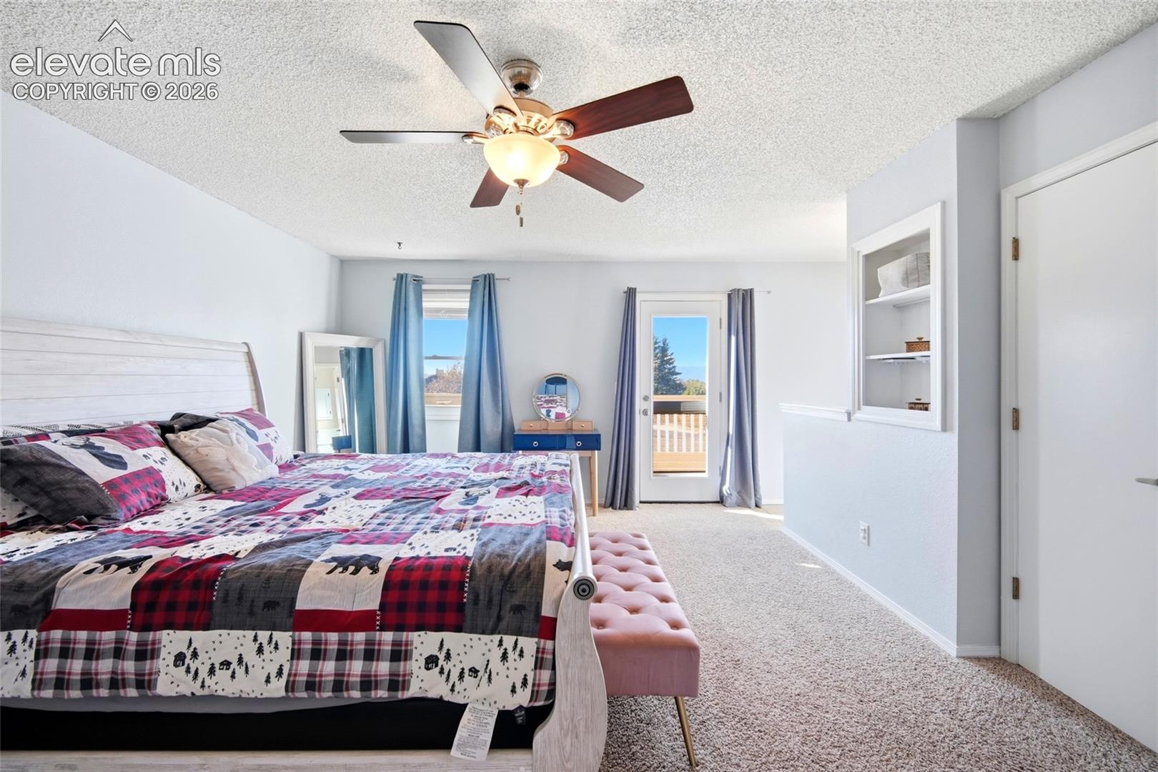 LARGE PRIMARY BEDROOM AND WALK OUT TO THE PRIVATE BALCONY.