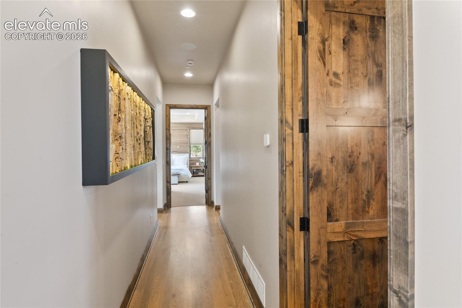 Hallway to private junior suite with powder room on the right. 