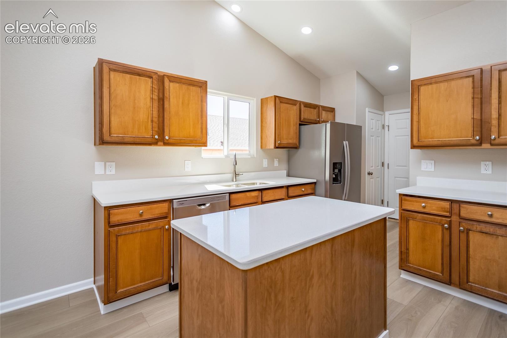 Warm colored cabinets, new countertops!