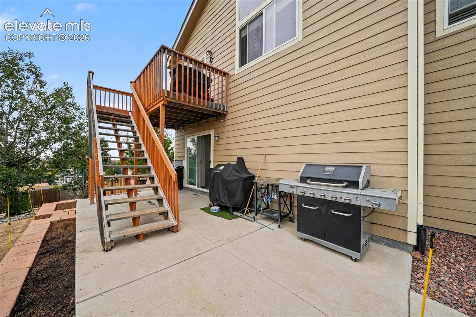Concrete patio with access to the deck