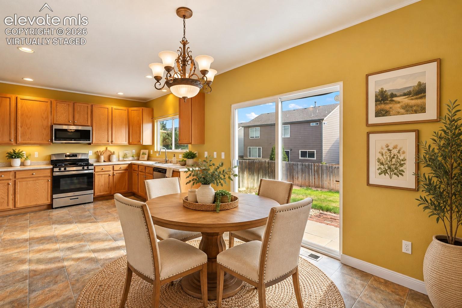 Tile flowers, recessed lighting kitchen flows into dining room and walks out. Virtually Staged