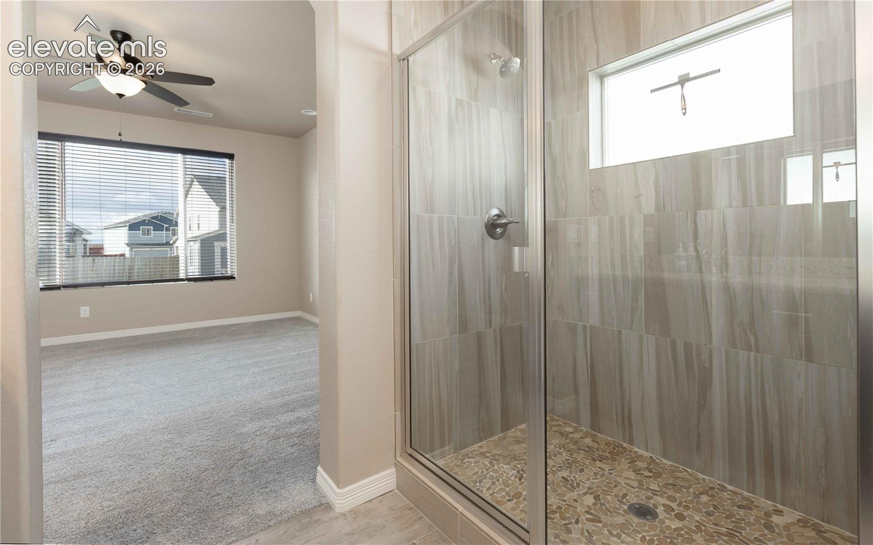 Dual shower heads in shower stall 