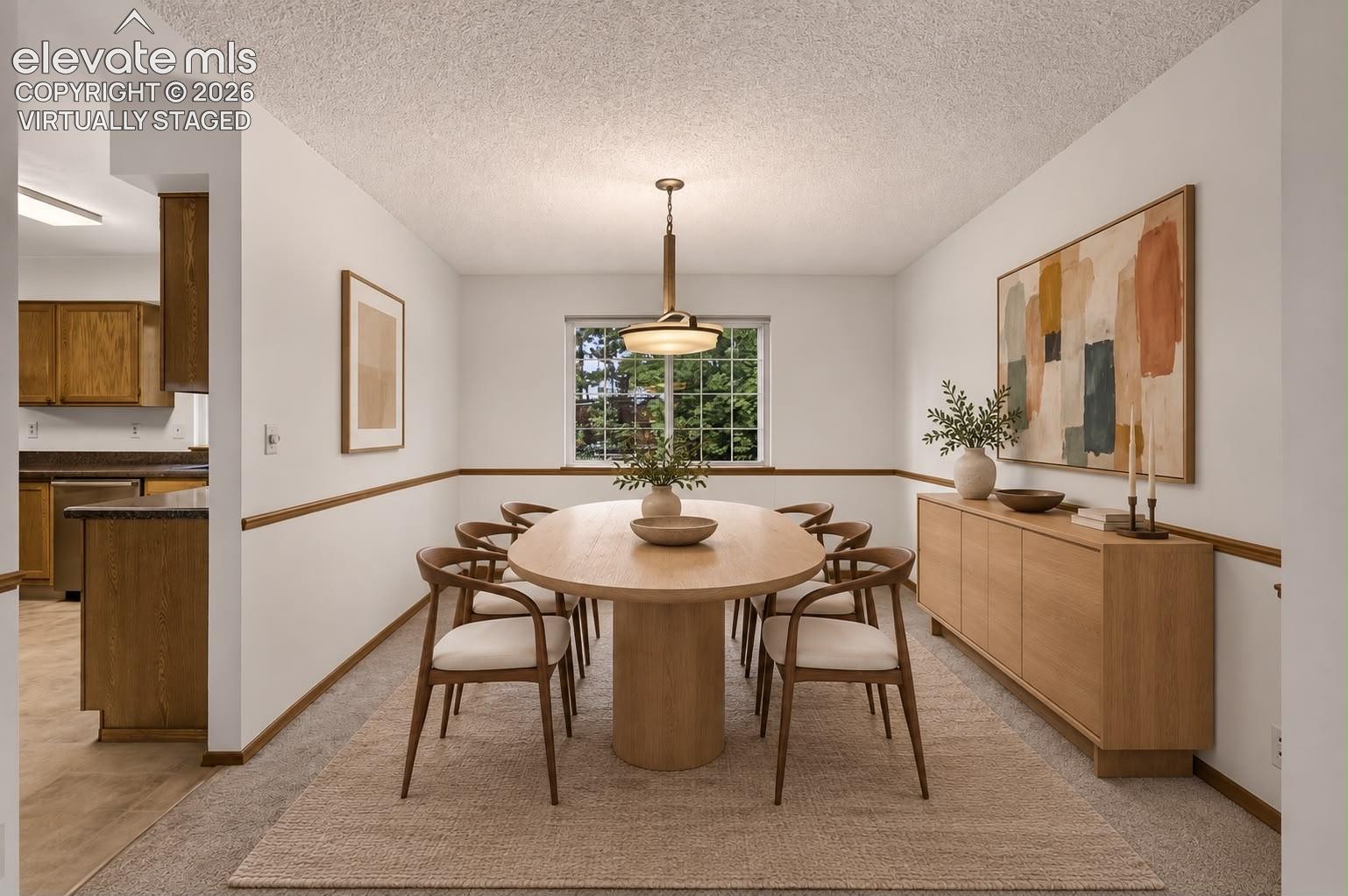Dining area open to Living room & kitchen.  Virtually Staged