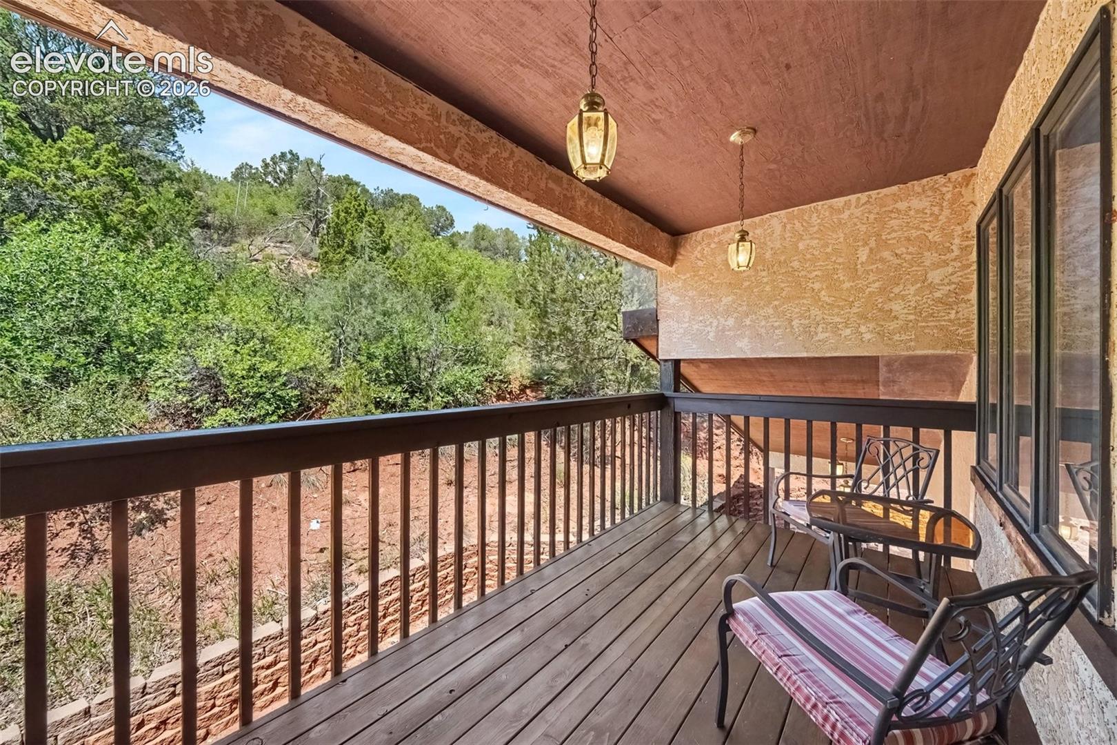 Stained covered deck accessible directly from the second primary bedroom