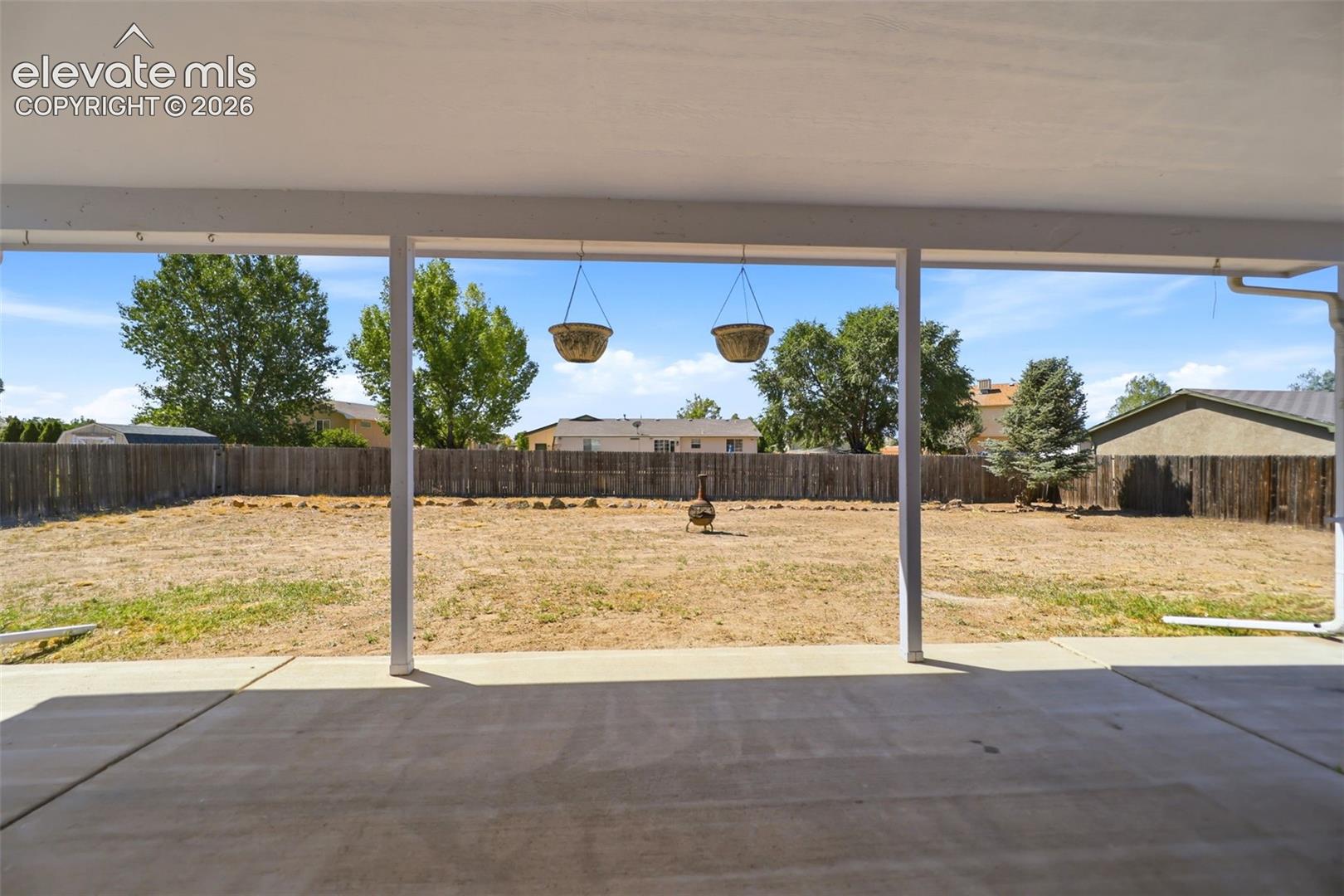 Covered Patio - 31' x 13' and back yard.