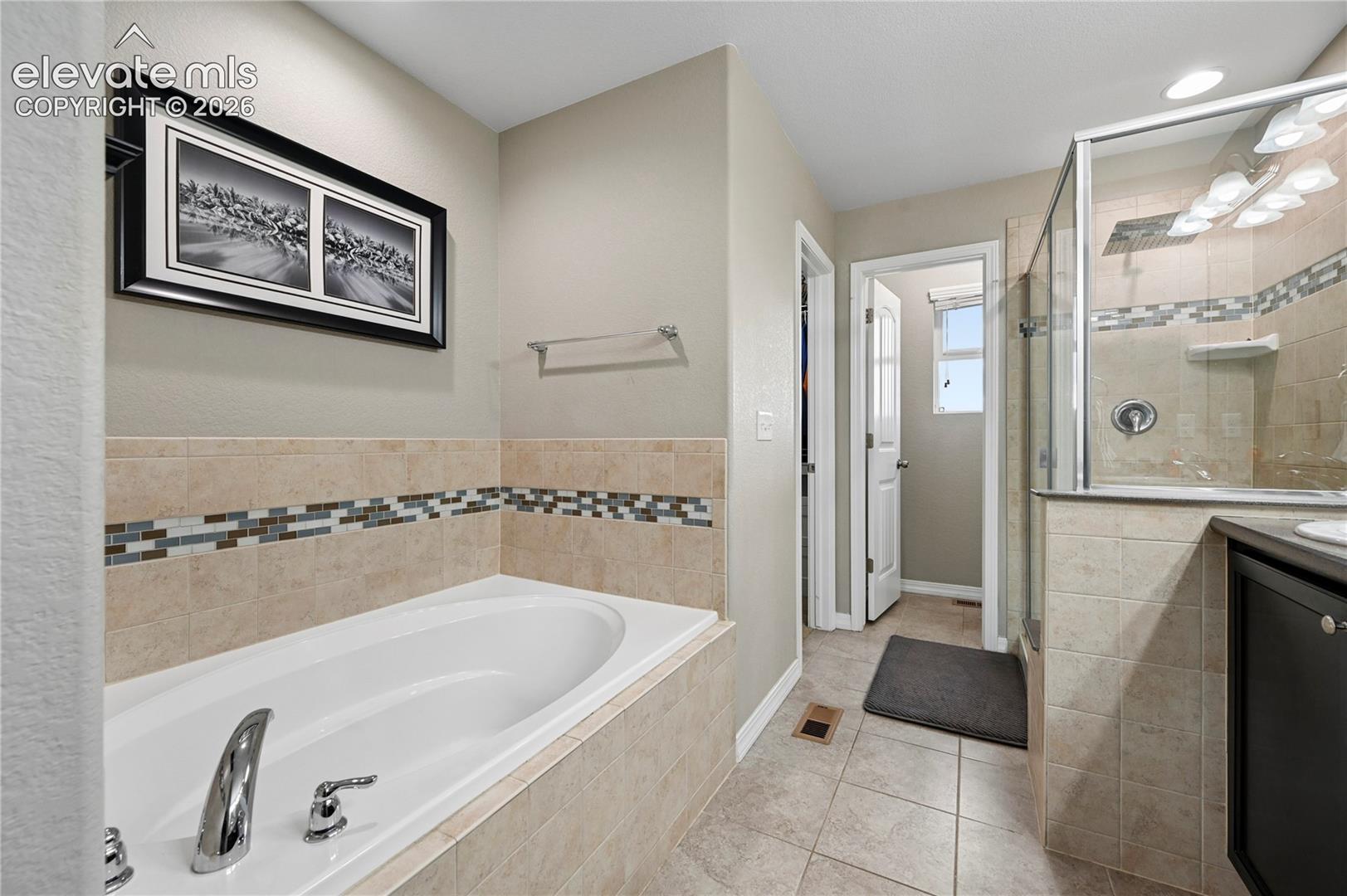 There's spaces in the master bathroom suite for morning showers and evening soaks in the tub, each with their own lighting, or turn out the lights and relax with some candles.