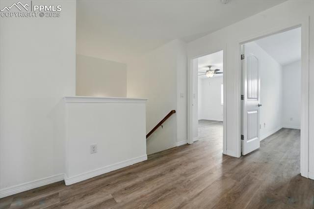 Empty room with wood finished floors and baseboards
