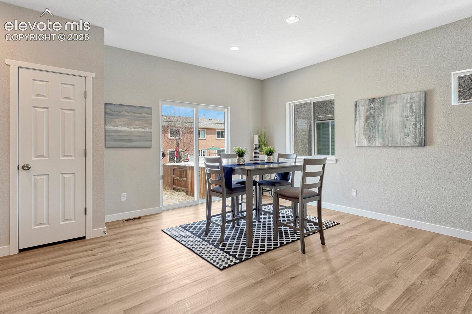 Dining area walks out to fully fenced backyard. Seamlessly move gatherings between indoors and outdoors.