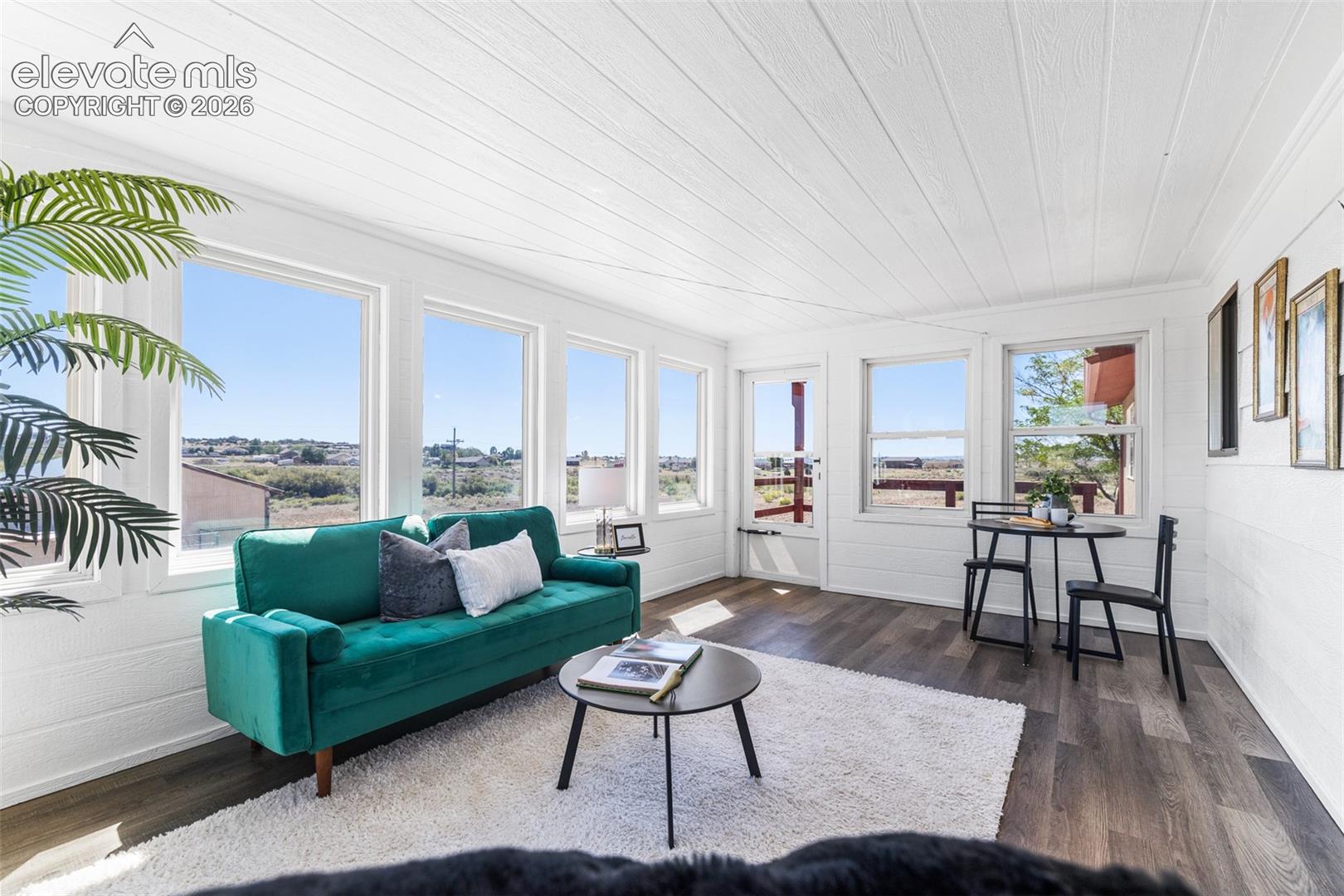Beautiful sunroom to enjoy any time of day.  Fully enclosed and wall to wall windows.  There are 2 entry/exits