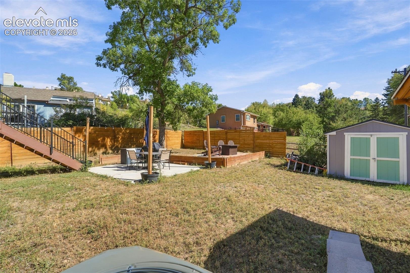 Back yard with storage shed too!