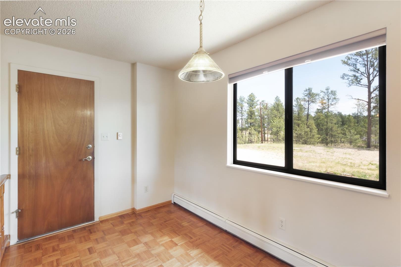 Breakfast nook off kitchen, door to garage on left